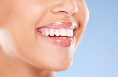 Person smiling after teeth whitening treatment